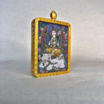 Side-angle view of Samantabhadra Bodhisattva brass Gau box necklace pendant.