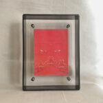 Front view of Shakyamuni Buddha Eyes print in a black floating translucent acrylic frame.