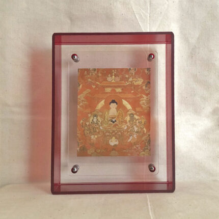 Front view of Shakyamuni Buddha Thangka print in a red floating translucent acrylic frame.