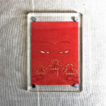 Frontal view of Shakyamuni Buddha Eyes acrylic block for orange color meditation.