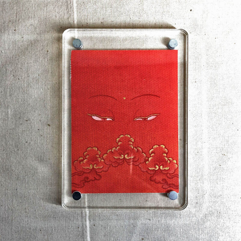 Frontal view of Shakyamuni Buddha Eyes acrylic block for orange color meditation.
