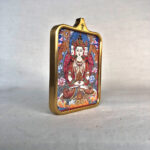 Side-angle view of Vairocana Buddha brass Gau box necklace pendant.