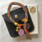 Vajrasattva purple bracelet presented with velvet pouch and Golden Ink Arts branded gift box.