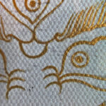 Close-up of original hand-painted gold linework and wisdom Buddha eyes on white canvas texture.