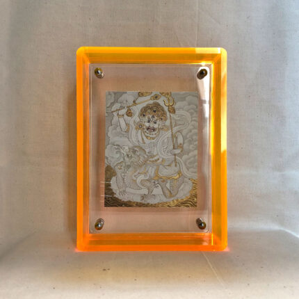 Front view of White Jambhala Thangka print in a yellow floating translucent acrylic frame.