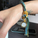 White Tara Buddha Eyes woven cord bracelet worn on wrist for daily meditation and spiritual protection.