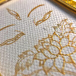 Macro detail of hand-painted gold linework on White Tara Buddha Eyes fine art canvas.