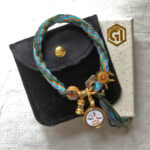 White Tara Buddha Eyes bracelet presented with black velvet pouch and Golden Ink Arts branded box.