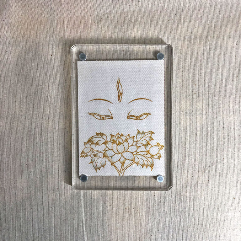Frontal view of White Tara Buddha Eyes acrylic block for white color meditation.