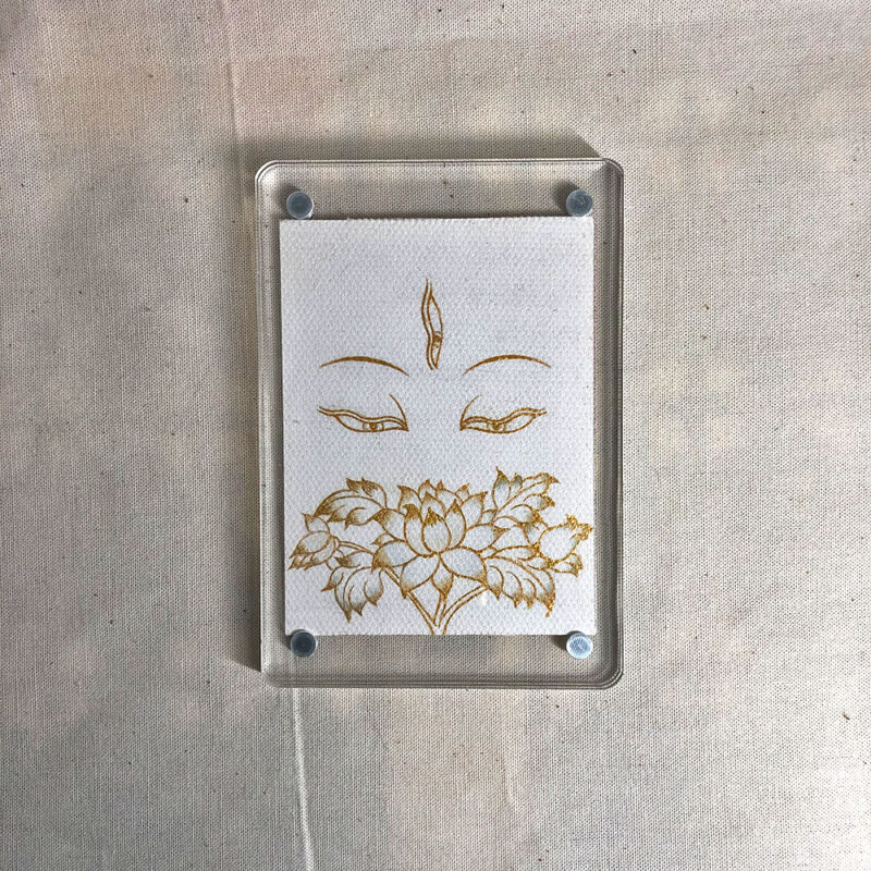 Frontal view of White Tara Buddha Eyes acrylic block for white color meditation.