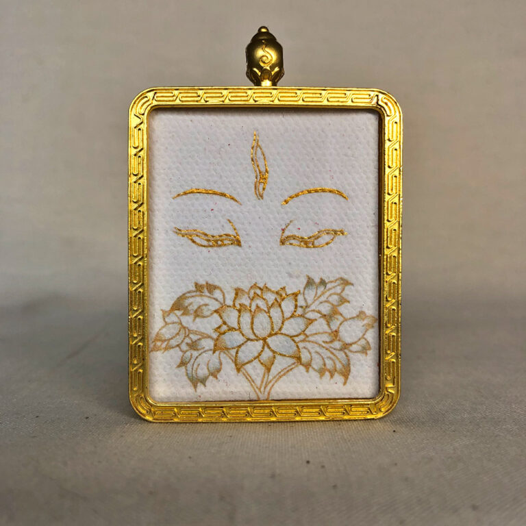 Frontal view of White Tara Buddha Eyes pendant for Crown Chakra color meditation.
