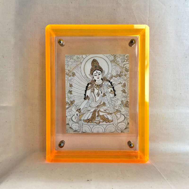 Front view of White Tara Thangka print in a yellow floating translucent acrylic frame.