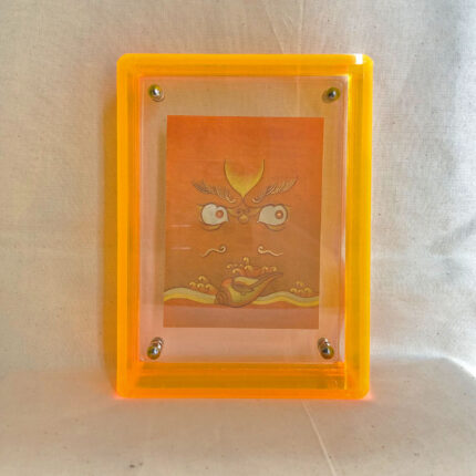 Front view of yellow Jambhala Buddha Eyes print in a yellow floating translucent acrylic frame.
