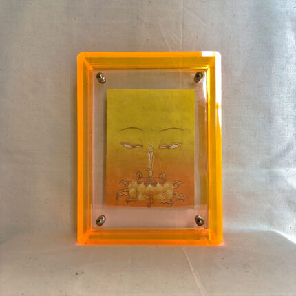 Front view of yellow Manjushri Buddha Eyes print in a yellow floating translucent acrylic frame.