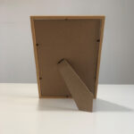 Back view of A4 natural wood photo frame showing sturdy easel back stand for tabletop display