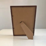Back view of A4 dark wood photo frame showing sturdy easel back stand for tabletop display