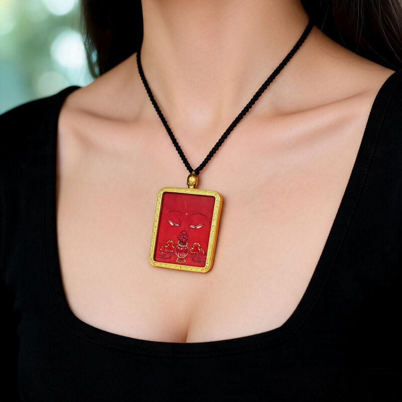 Gold Ghau pendant with hand-drawn Amitayus Buddha eye in orange gold