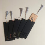 Chinese calligraphy bookmarks presented with elegant black protective paper card sleeves.