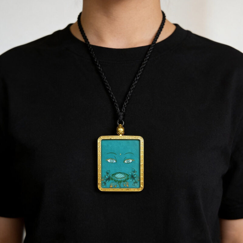 Green Ghau pendant featuring hand-drawn Green Tara Buddha eye art