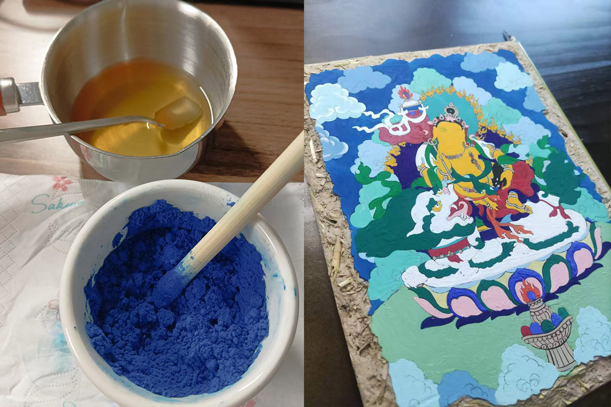 Artist hand-grinding natural lapis lazuli blue pigment in a bowl alongside a vibrant hand-painted Thangka artwork.