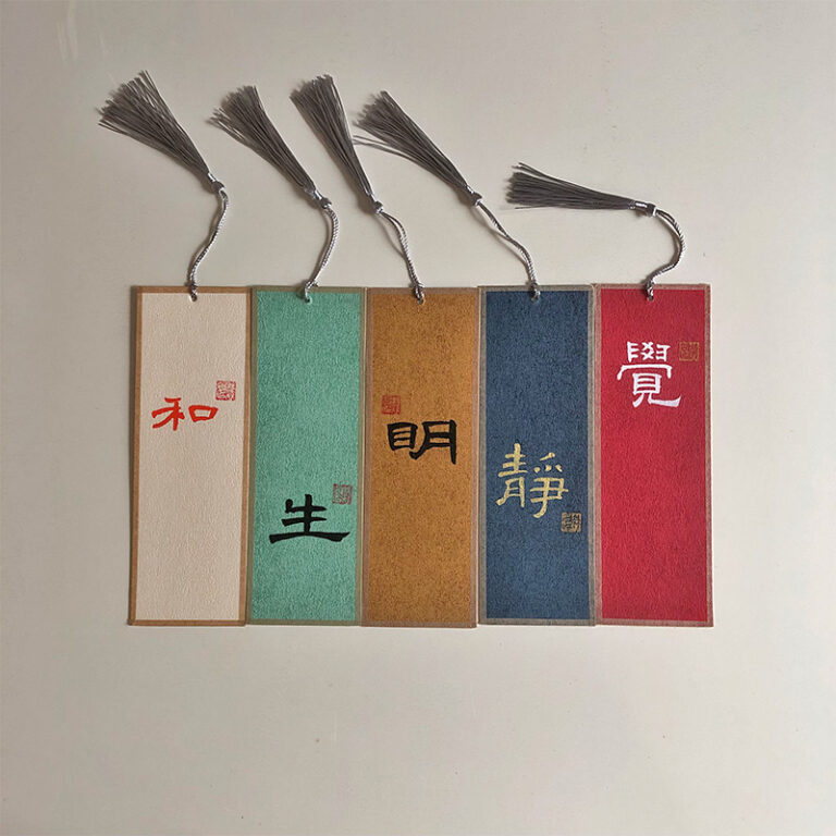 Set of 5 vibrant handcrafted Chinese calligraphy bookmarks on colorful Xuan paper with tassels and seal stamps.