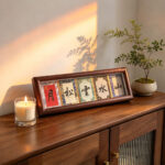Song Brocade calligraphy display Mountains Water Clouds Pines Moon on a wooden cabinet in warm golden hour light.