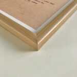 Macro detail of smooth natural wood frame corner for A4 calligraphy art display