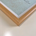 Macro detail of smooth natural oak wood frame corner for A4 art display