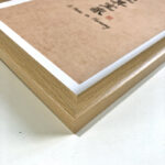 Macro detail of smooth natural wood frame corner for A4 home harmony art display