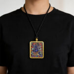 Dark color energy Vajrapani artwork in artisan gold Ghau pendant